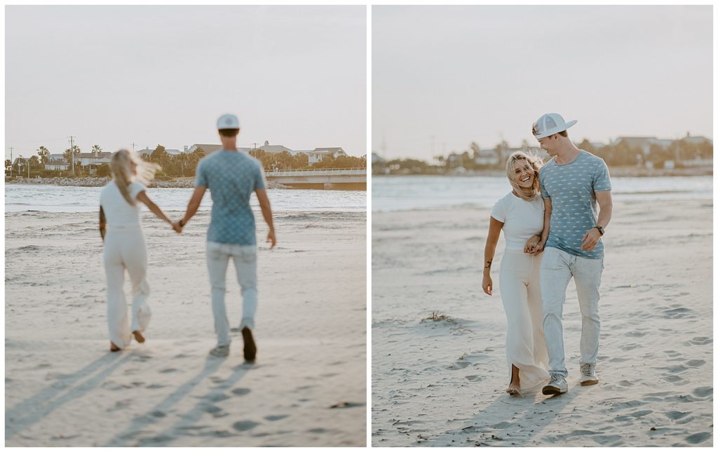 a couple walking away and towards the camera at the beach laughing