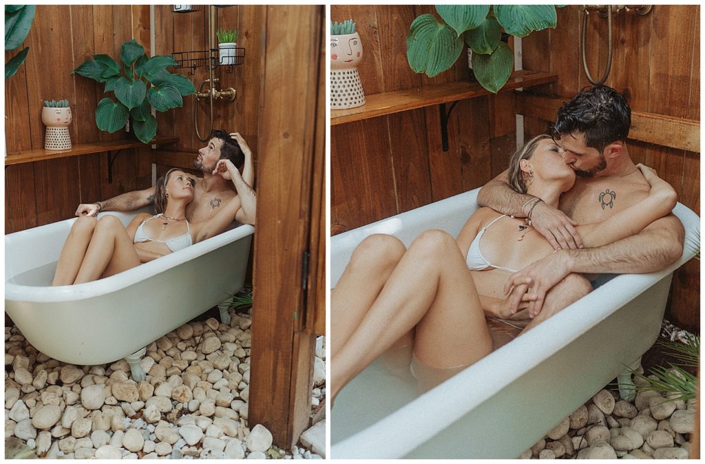 a couple laying in an outdoor bathtub with plants around them in florida