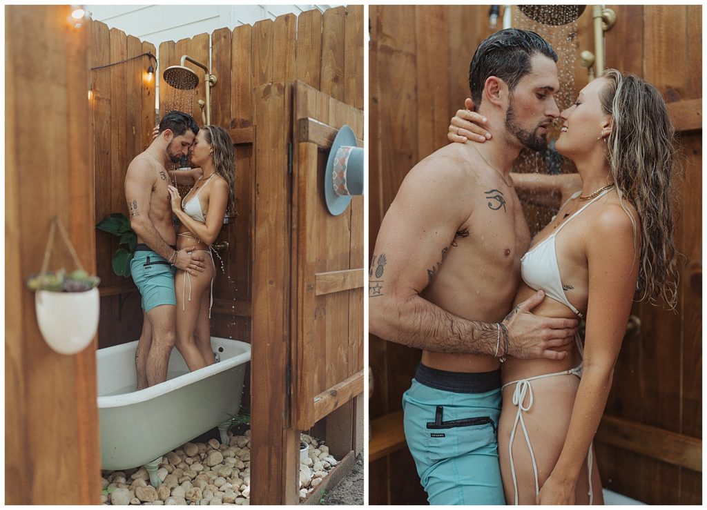 a couple standing up in the outdoor bathtub about to kiss with the shower running in florida