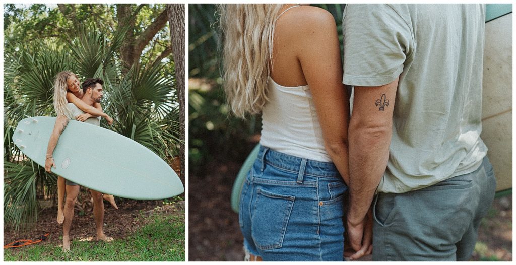 a couple posing in front of palm trees with a surfboard in florida