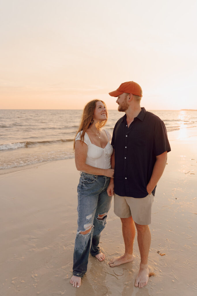 Couple standing by the ocean during couples session
