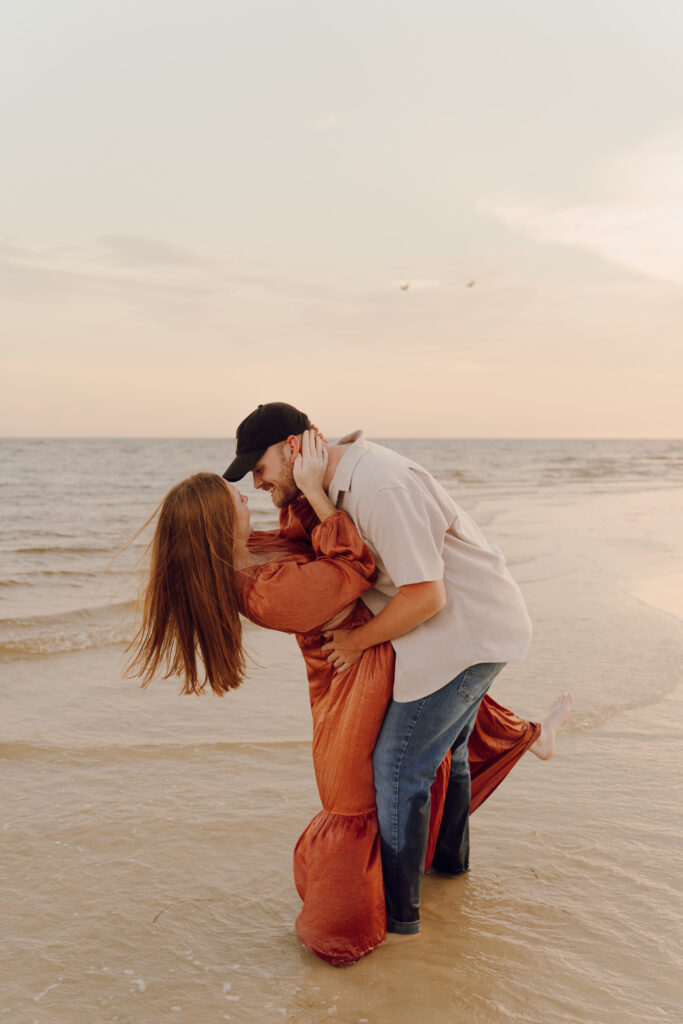 Couple dancing by the ocean during couples session
