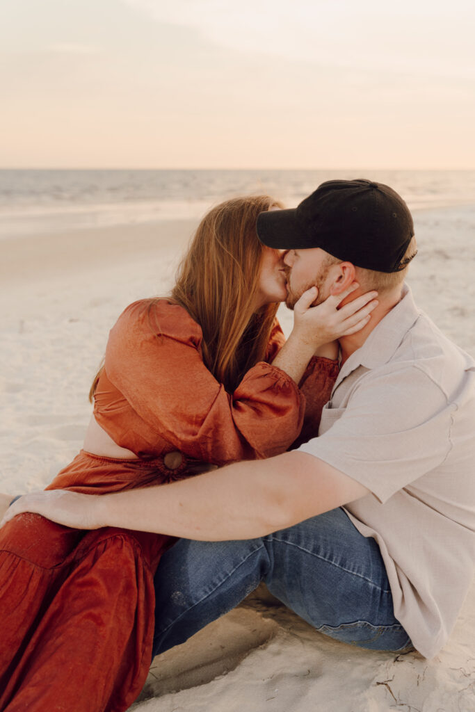 Couple kissing by the ocean during couples session