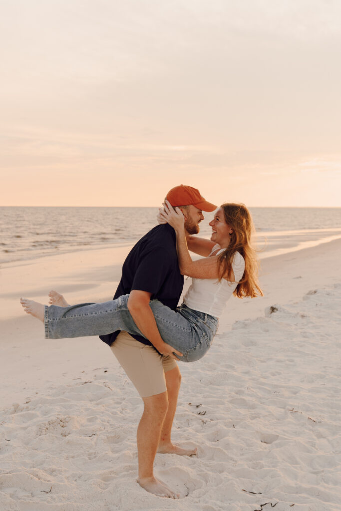Couple hugging each other at beach photoshoot at Alligator Point in Florida