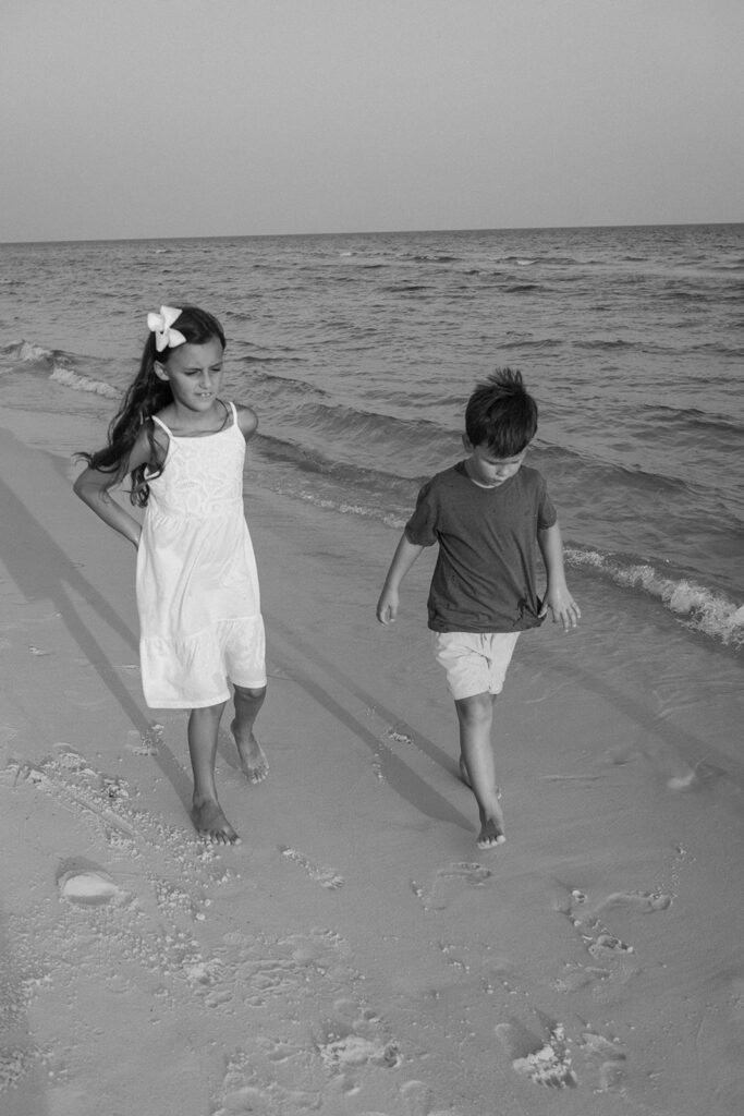 Children walking along the beach at family photo session at Destin Beach in Florida