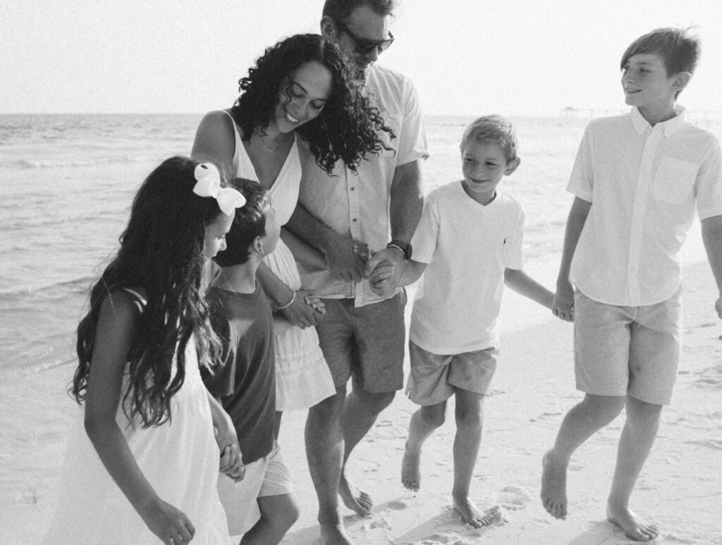 Family by the beach front at Destin Beach in Florida