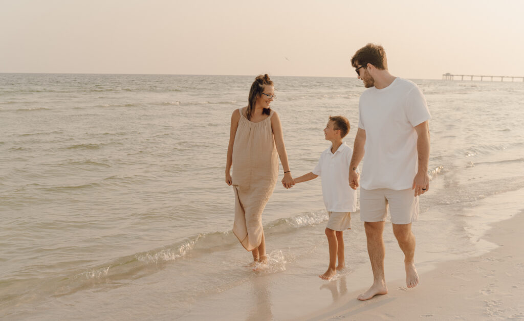 Family by the beach front at Destin Beach in Florida