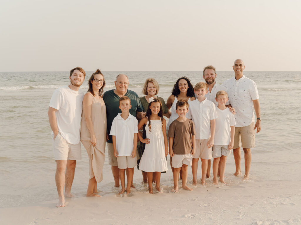 Big family smiling by the sea at Destin Beach in Florida