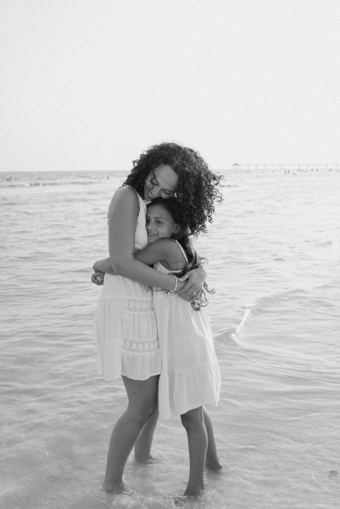 Mother and daughter playing in the sea