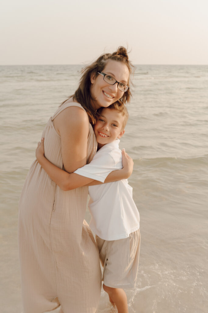 Family in sea at beach photoshoot