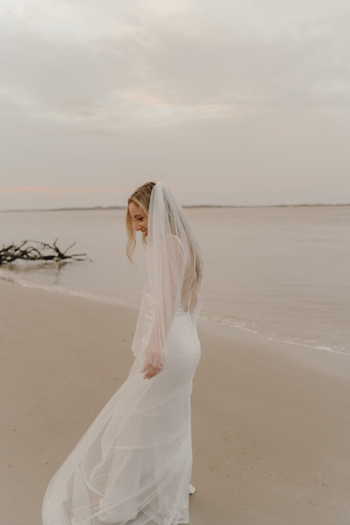 Bride by the sea at Beach elopement at Folly Beach South Carolina