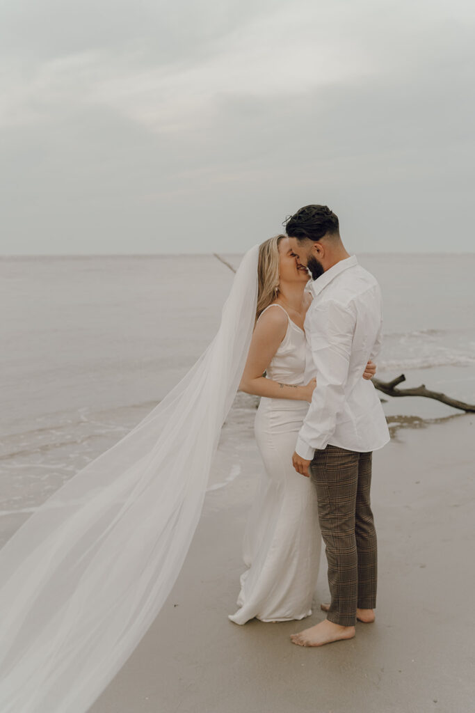 Couple by the sea at Beach elopement in South Carolina