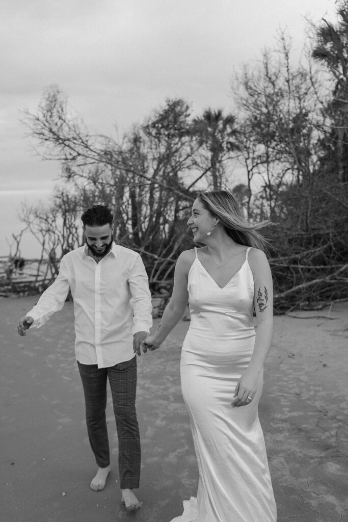Couple by the sea at Beach elopement at Folly Beach South Carolina