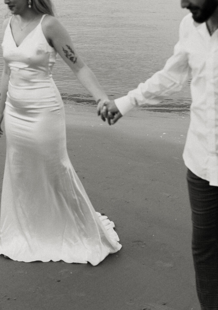 Couple by the sea at Beach elopement at Folly Beach South Carolina