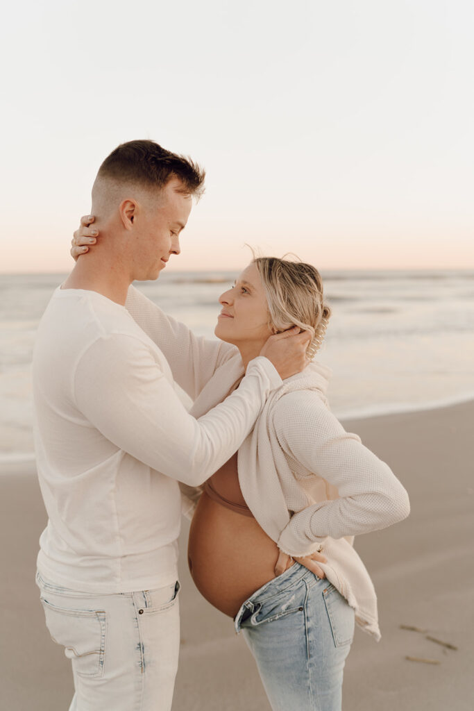 Couple embracing during maternity shoot
