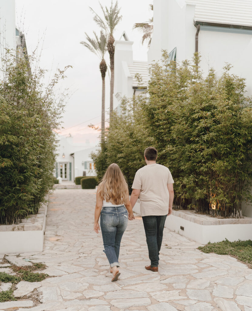 couple holding hands for engagement photos in florida
