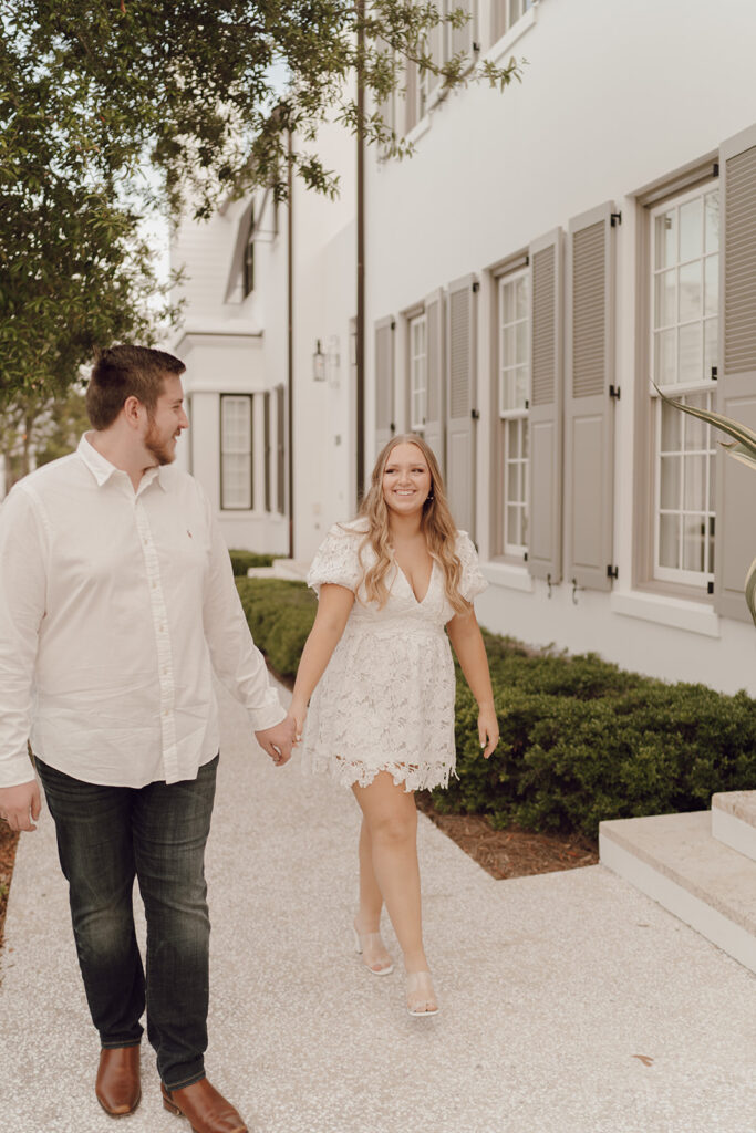 couple holding hands for engagement photos in florida