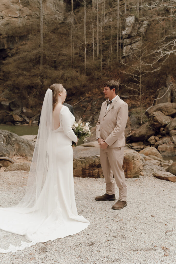 destination elopement cermony at toccoa falls with waterfall