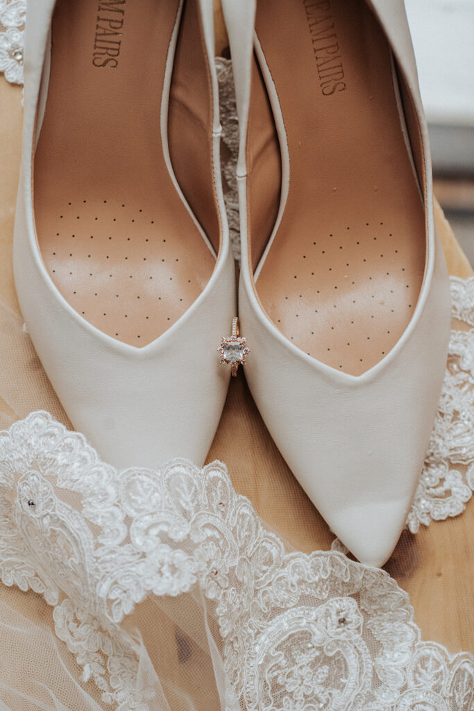 wedding shoes and ring and dress