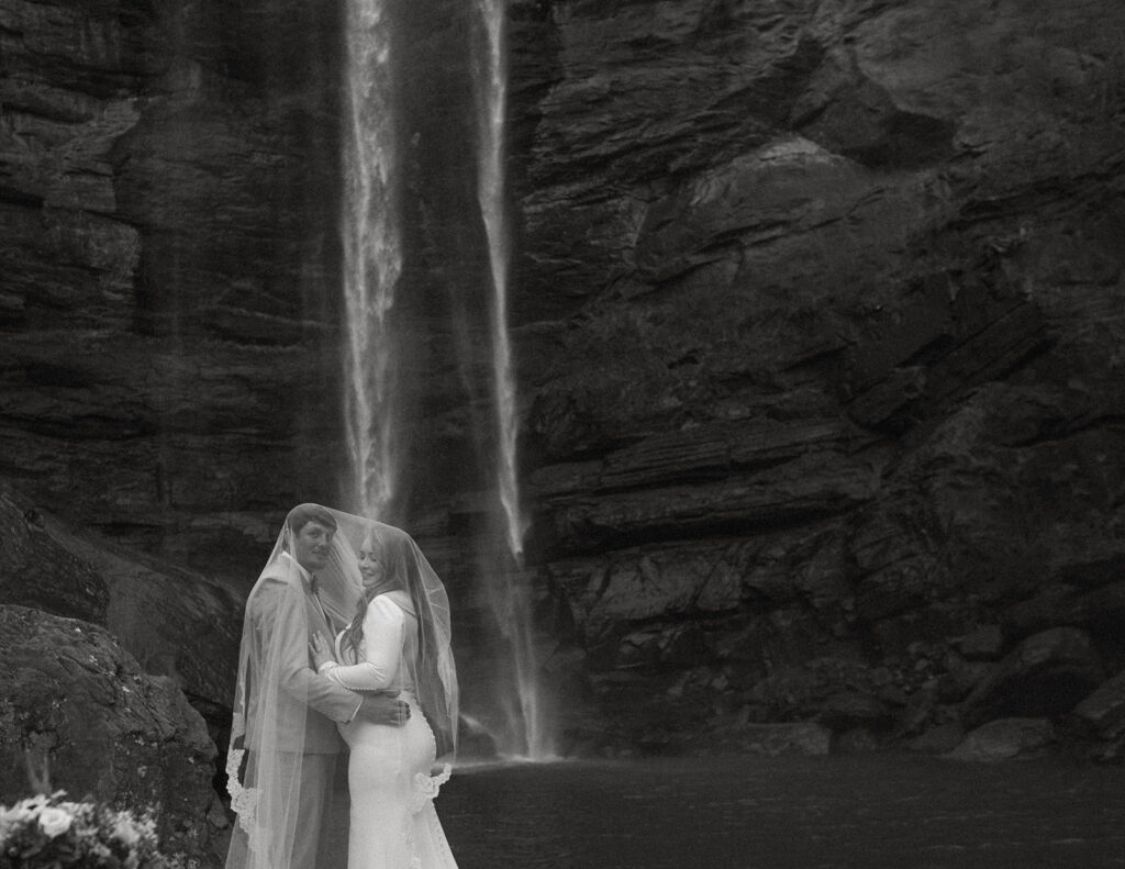 couple under veil during destination elopement in toccoa falls