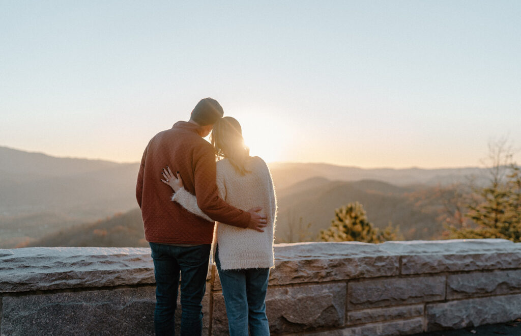couple hugging and looking at the great smoky mountains