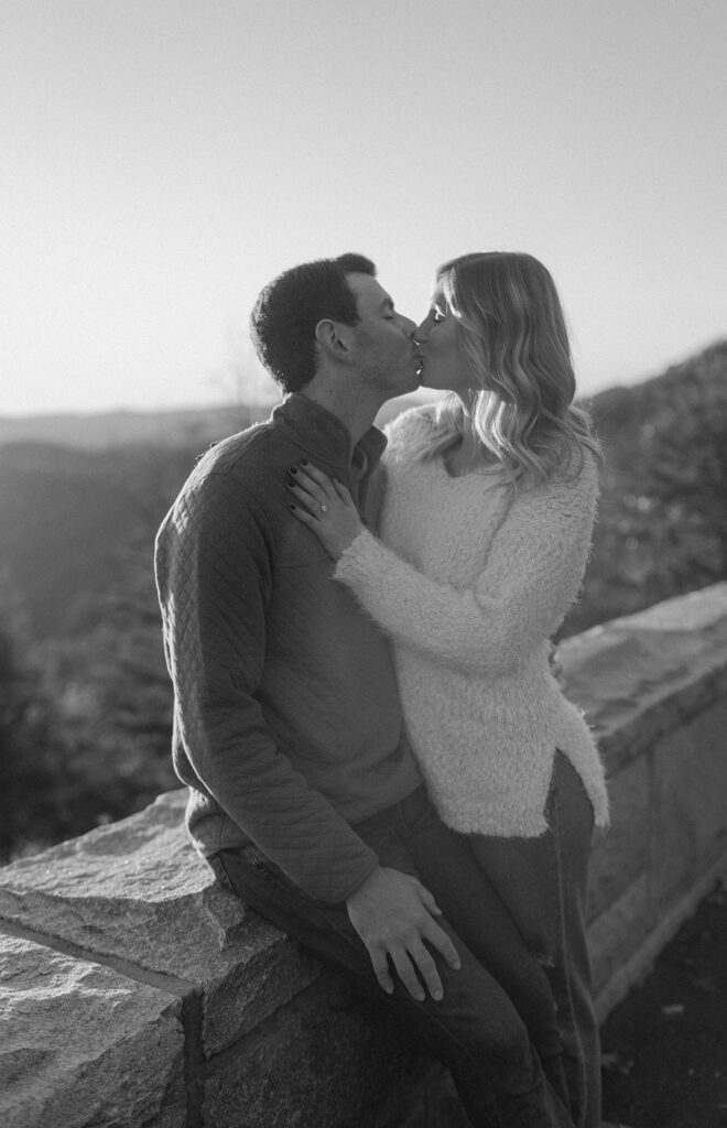 couple kissing in front of the tennessee mountains in gatlinburg