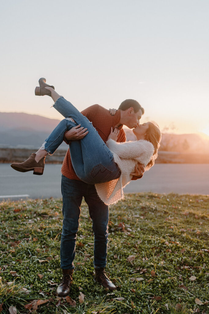 guy carrying girl bridal style and kissing for smoky mountain engagement photos