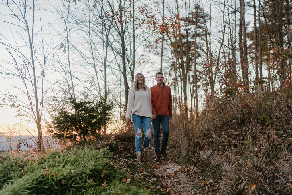 couple walking and smiling engagement session