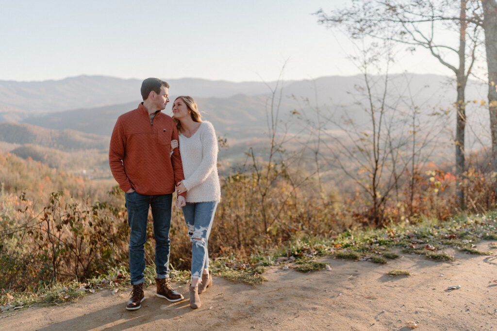 couple holding hands for smoky mountain engagement photos