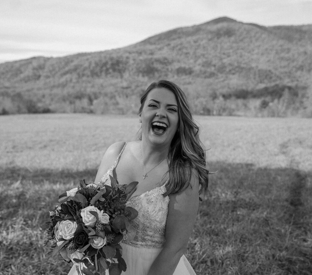 bride smiling with elopement bouquet