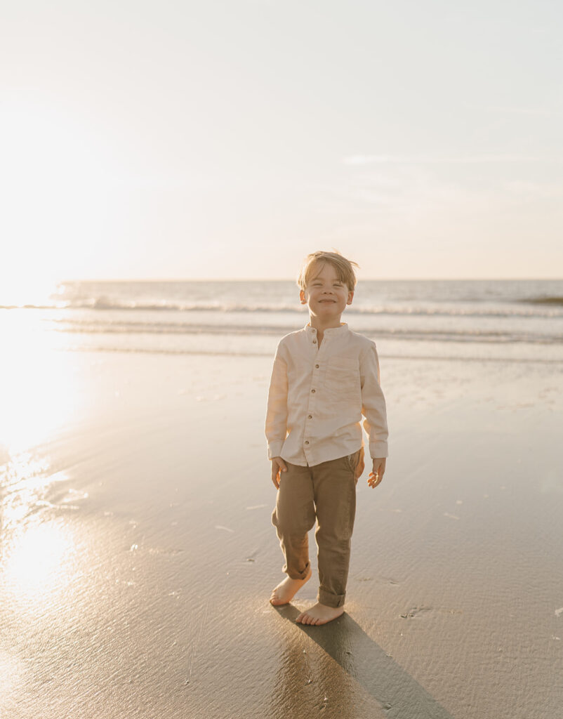 toddler smiling for beach family pictures