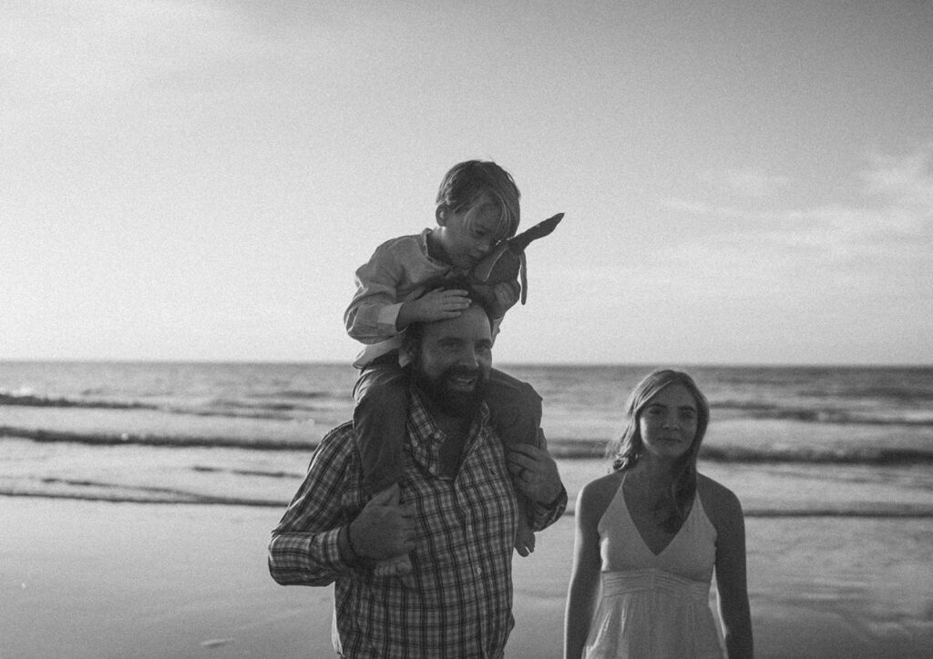 black and white family photos on the beach