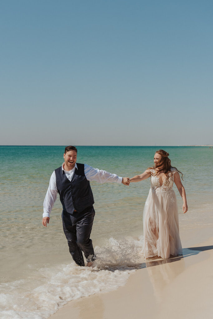 bride and groom wedding trash the dress photoshoot on the beach