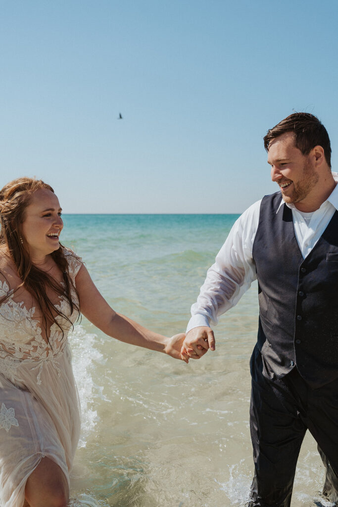 bride and groom smiling and laughing in destin florida