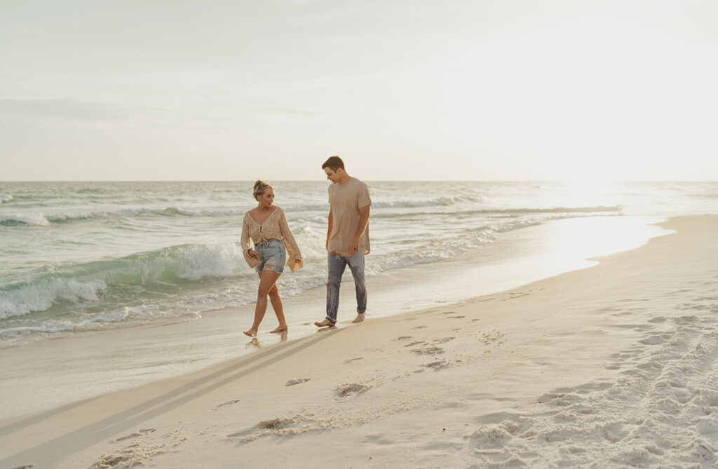 couple walking on 30A during engagement photo session