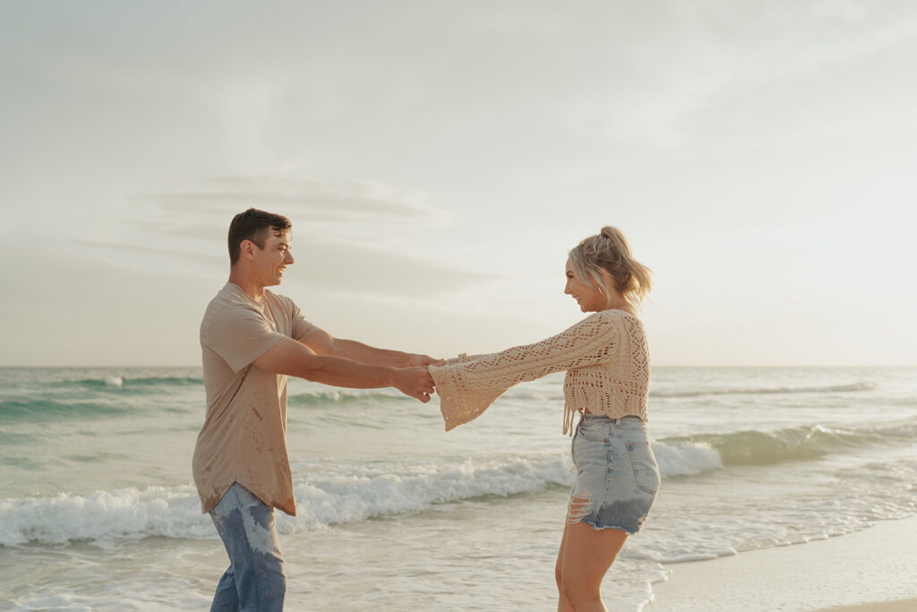 couple holding hands playful engagement photos