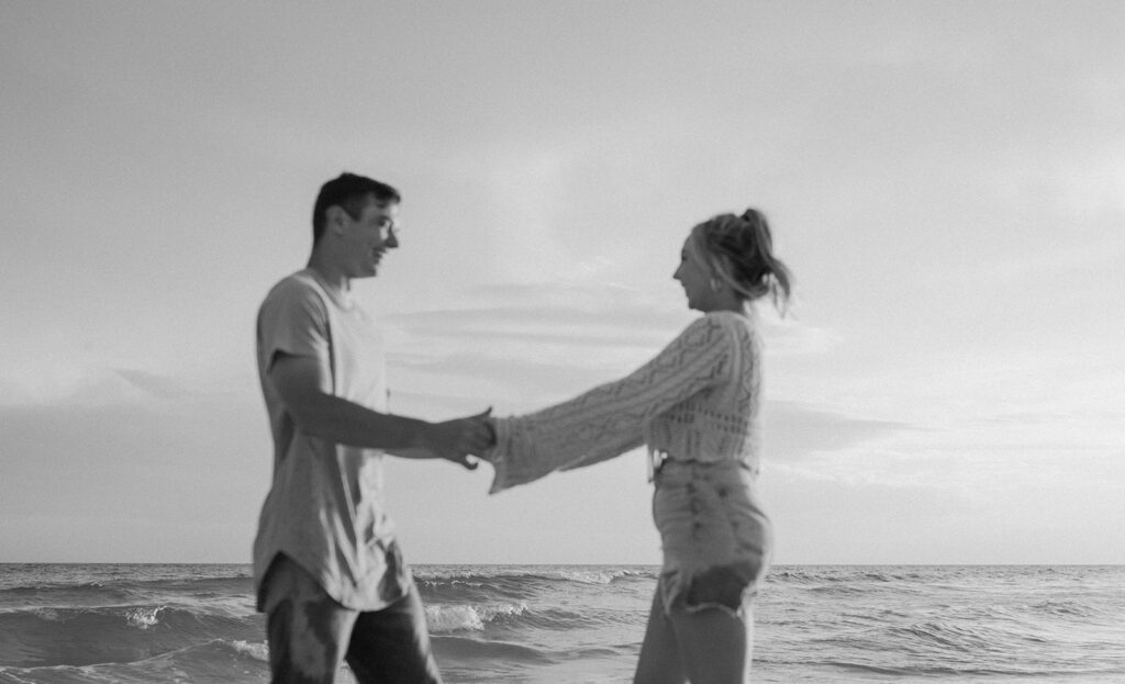 black and white couple photos couple holding hands and smiling