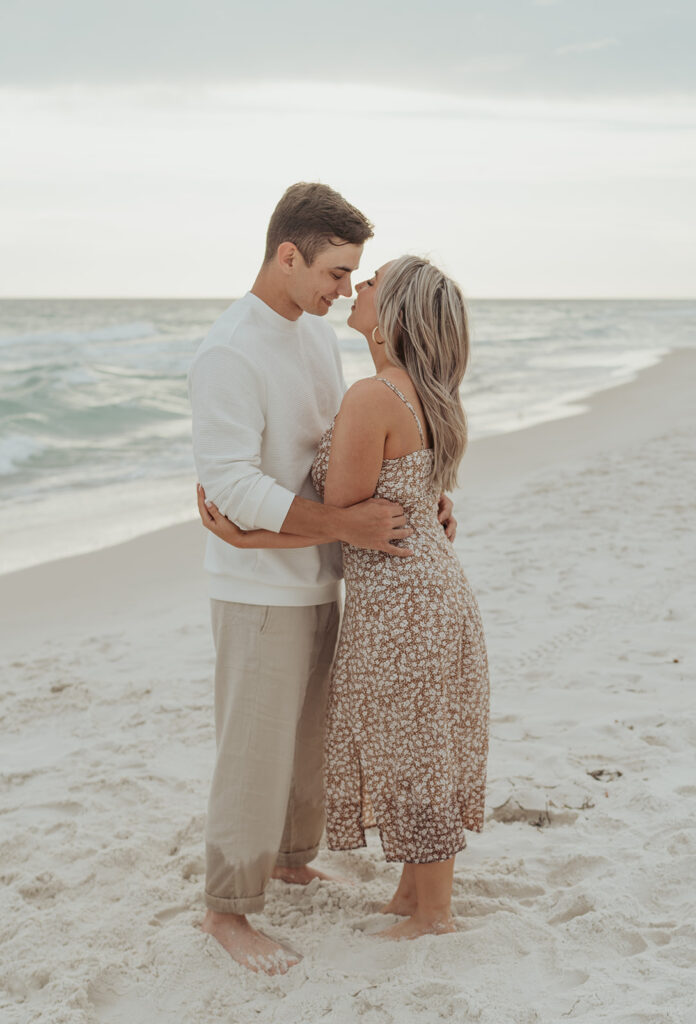 couple engagement photos on the beach in seaside florida