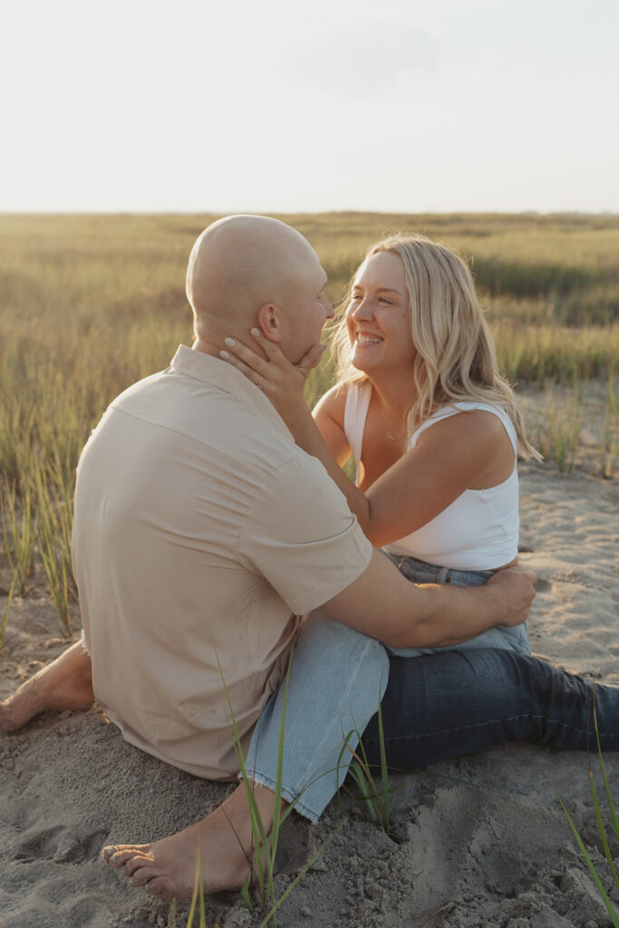 playful engagement poses for beach engagement in charleston south Carolina