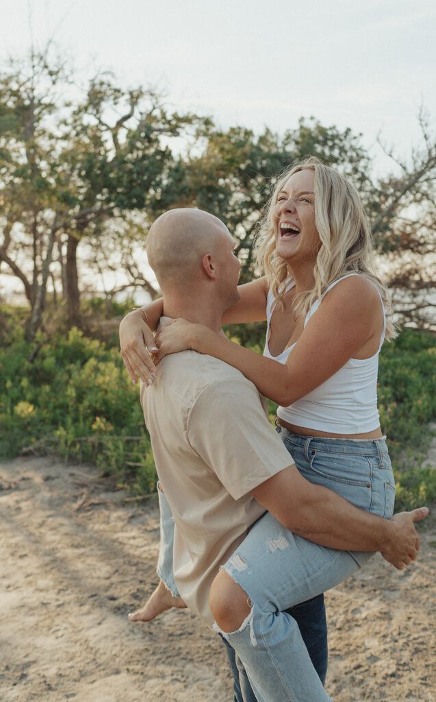candid couple photos for folly beach engagement couple laughing