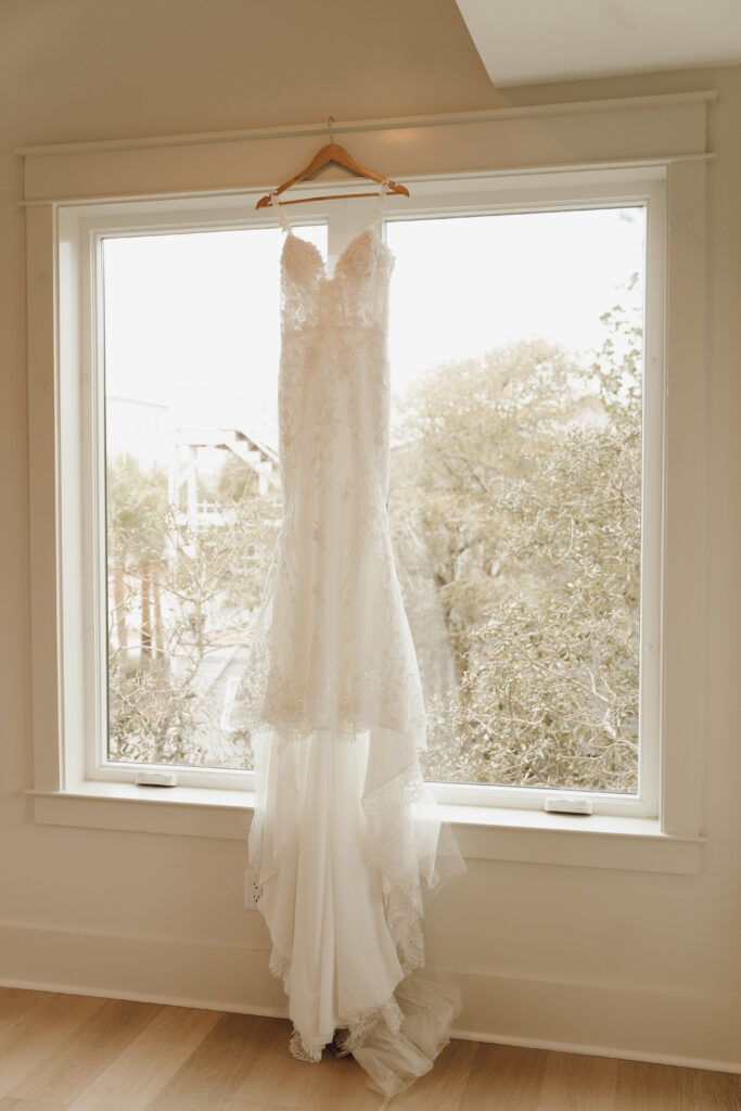wedding dress hanging up in house
