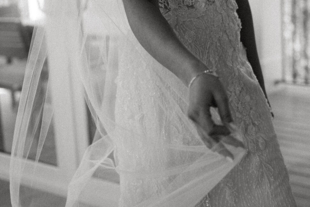 blurry photo of bride walking holding her wedding veil