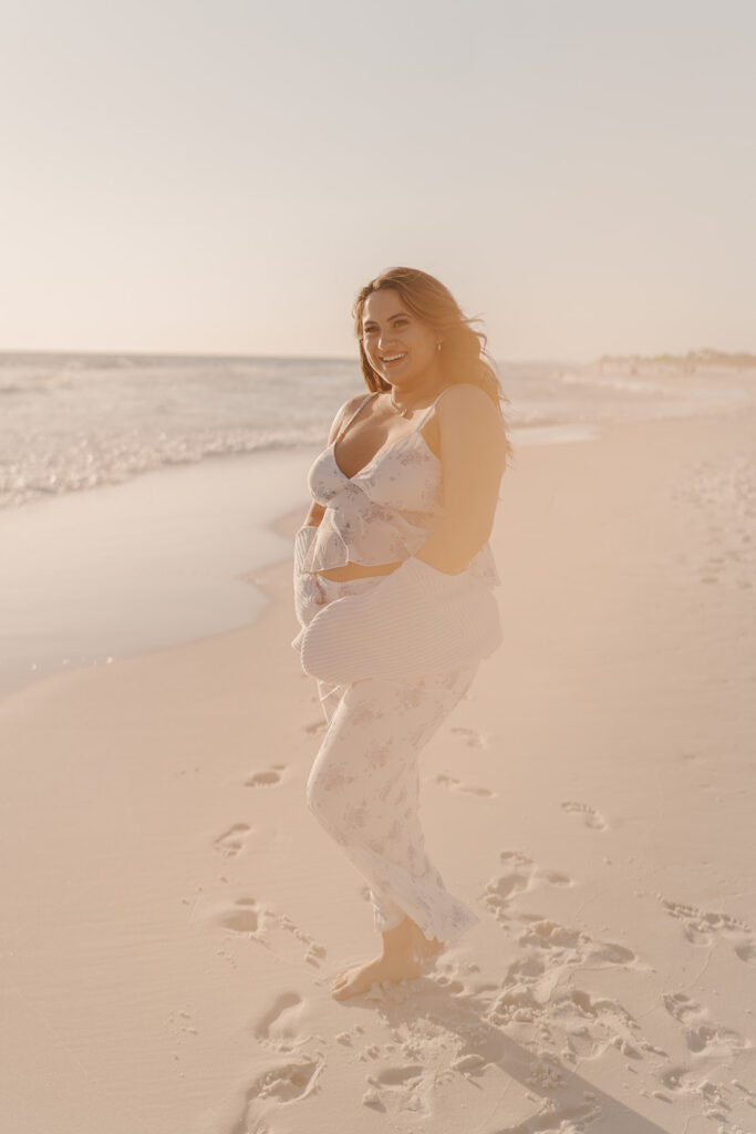 playful and candid maternity photoshoot on the beach in florida