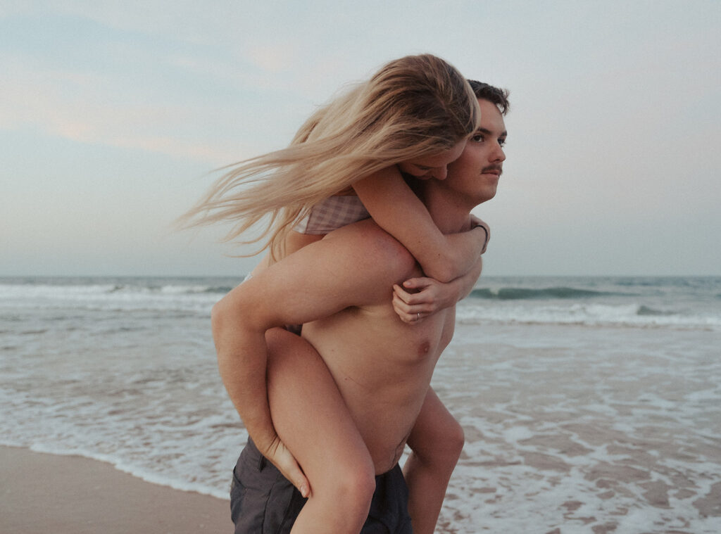 piggy back poses for beach engagement pictures