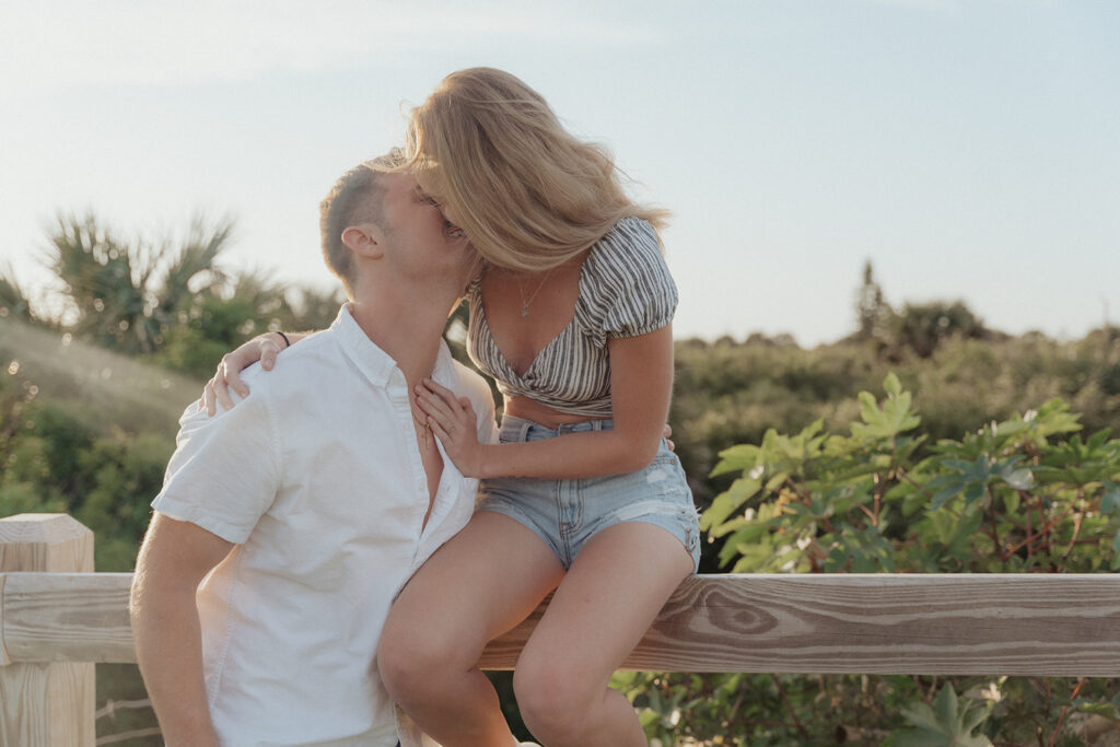 couple kissing during beach couple session
