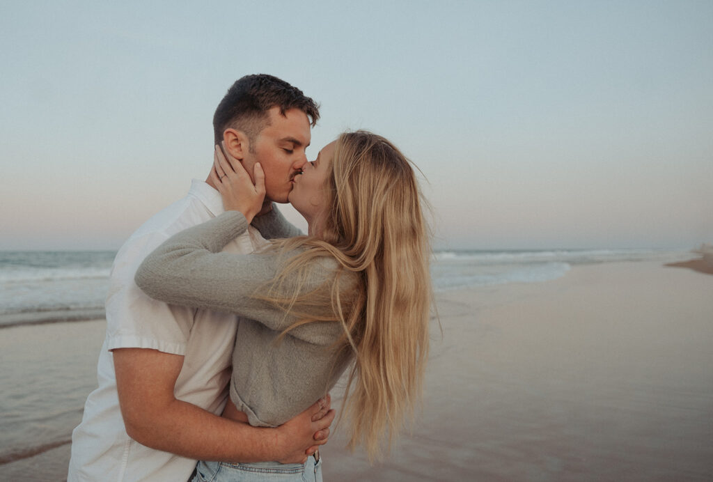 couple kissing beach engagement photos daytona photographer