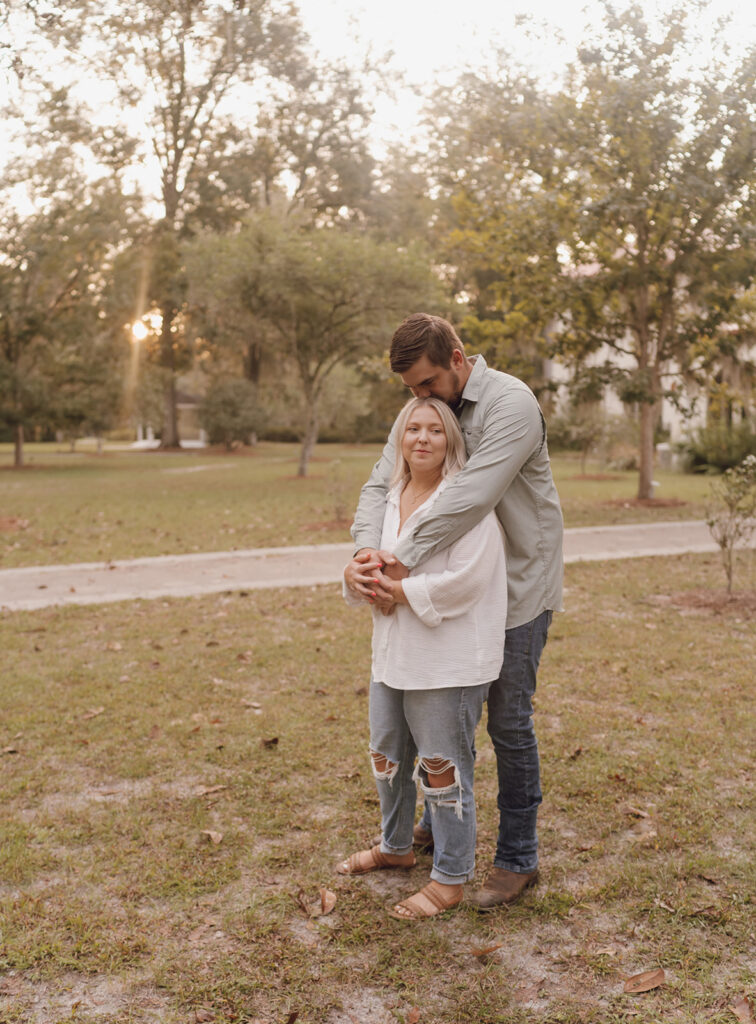 couple hugging during fall engagement session
