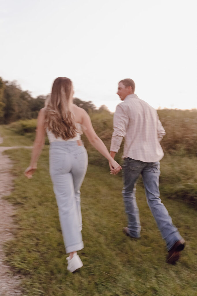 blurry couple running pictures romantic and candid engagement photos