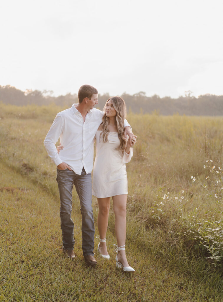 golden hour engagement photos neutral outfits