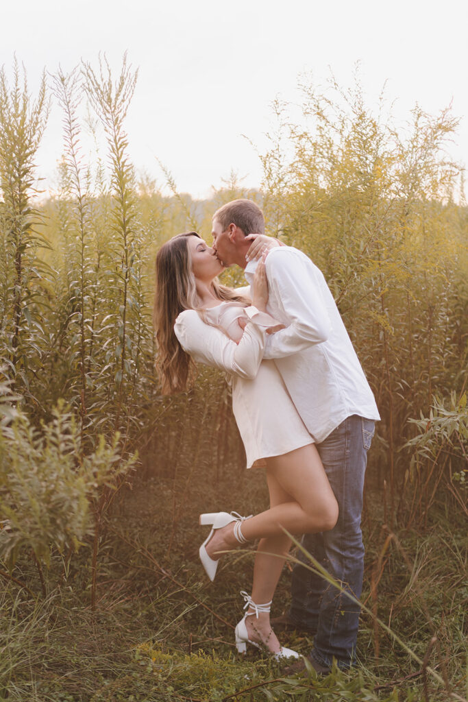 couple kissing candid engagement pictures